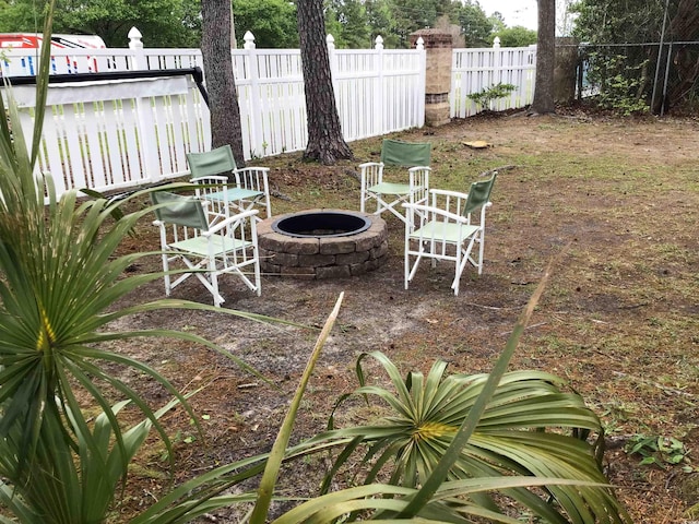 view of patio featuring an outdoor fire pit