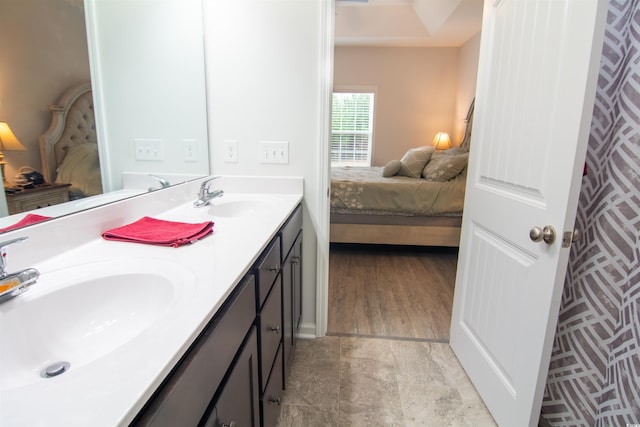 bathroom with vanity and hardwood / wood-style floors