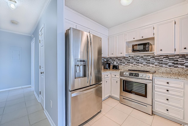 kitchen with tasteful backsplash, white cabinetry, stainless steel appliances, and ornamental molding