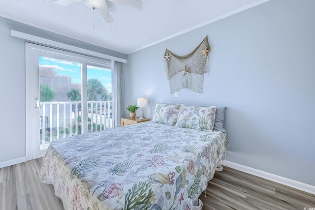 bedroom featuring crown molding, ceiling fan, wood finished floors, access to outside, and baseboards