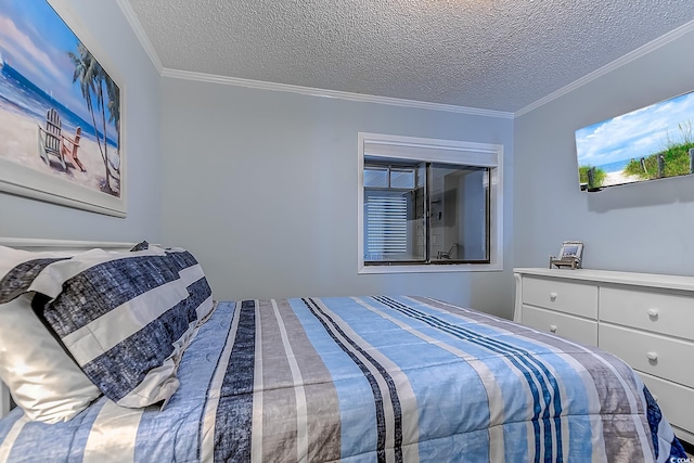 bedroom featuring ornamental molding and a textured ceiling