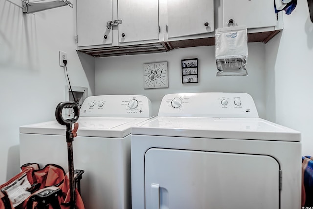 laundry room with cabinet space and washer and dryer