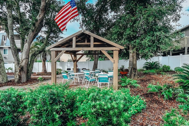 view of patio with a fenced backyard and a gazebo