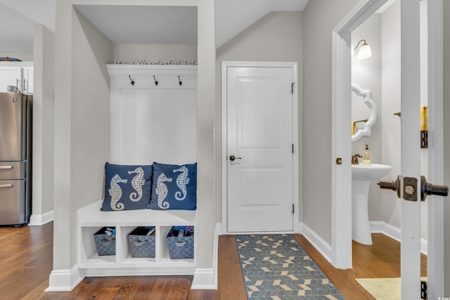 mudroom with baseboards and wood finished floors