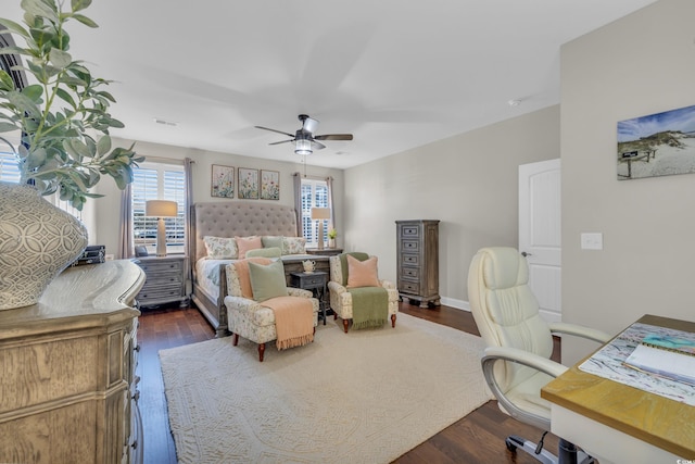 bedroom featuring ceiling fan and dark wood finished floors