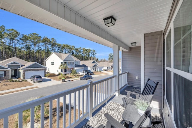 balcony with a residential view and covered porch