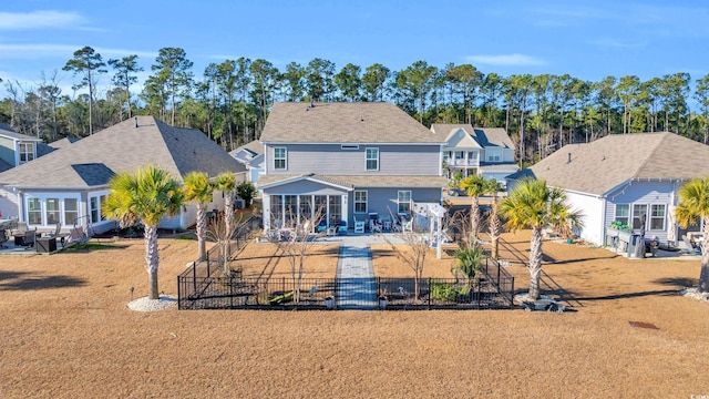 rear view of property featuring fence private yard, a patio area, and a residential view