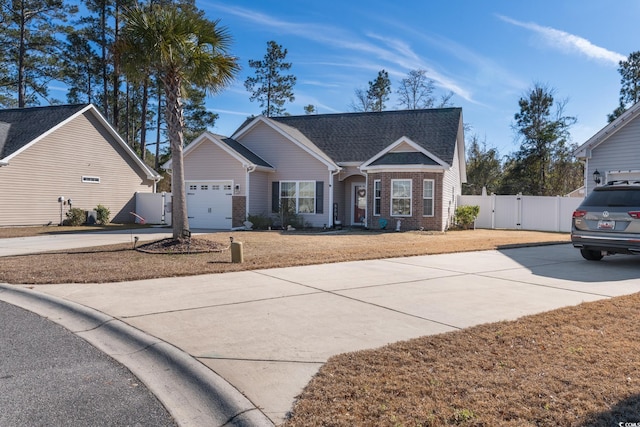 view of front of house featuring a front lawn and a garage