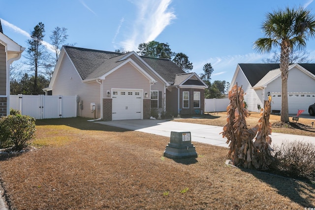 view of front of property with a front lawn and a garage