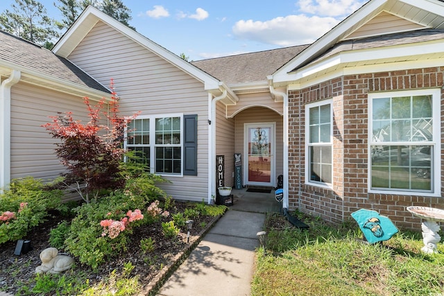 160 Maggie Way, Myrtle Beach, SC 29588 - doorway to property featuring roof with shingles and brick siding