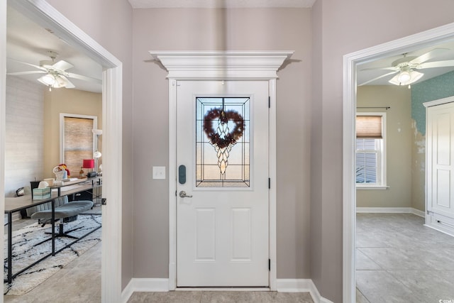 tiled entrance foyer with ceiling fan