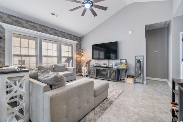 living room featuring high vaulted ceiling, light tile patterned floors, and ceiling fan