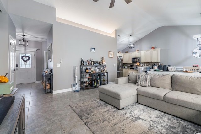 living room with high vaulted ceiling and ceiling fan