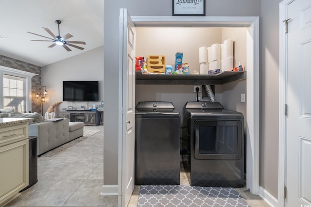 laundry room featuring ceiling fan, independent washer and dryer, and light tile patterned floors