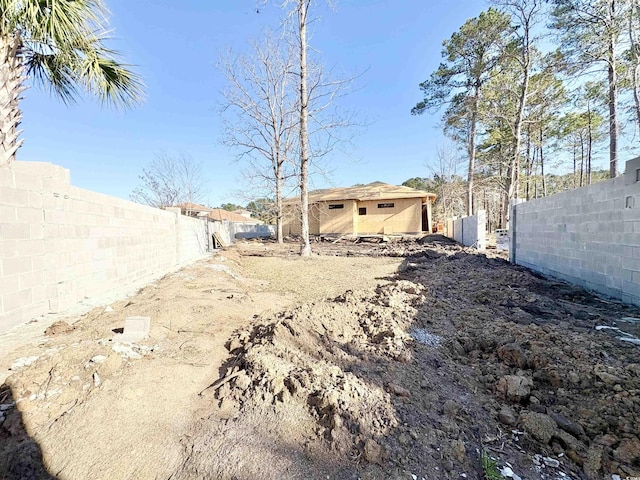 view of yard with a fenced backyard