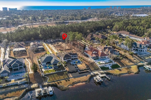 bird's eye view with a residential view and a water view