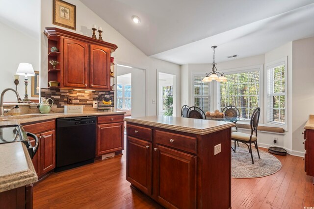 kitchen featuring decorative light fixtures, a notable chandelier, decorative backsplash, sink, and black dishwasher