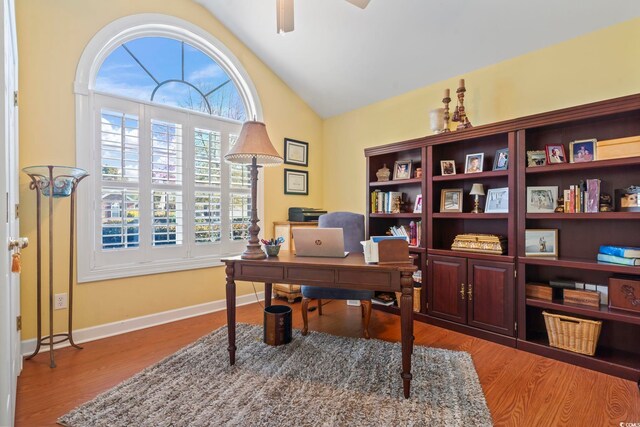 office featuring ceiling fan, vaulted ceiling, and light hardwood / wood-style floors