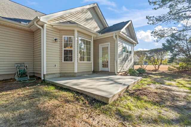 rear view of house with a patio