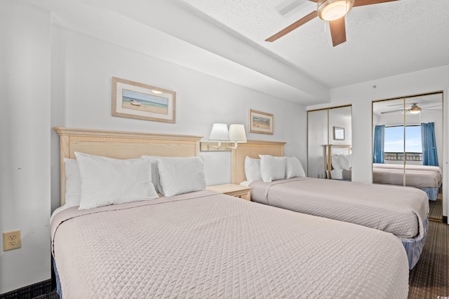 bedroom featuring a textured ceiling and ceiling fan