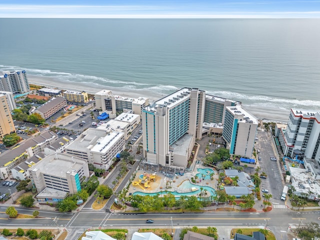 aerial view with a water view and a view of the beach