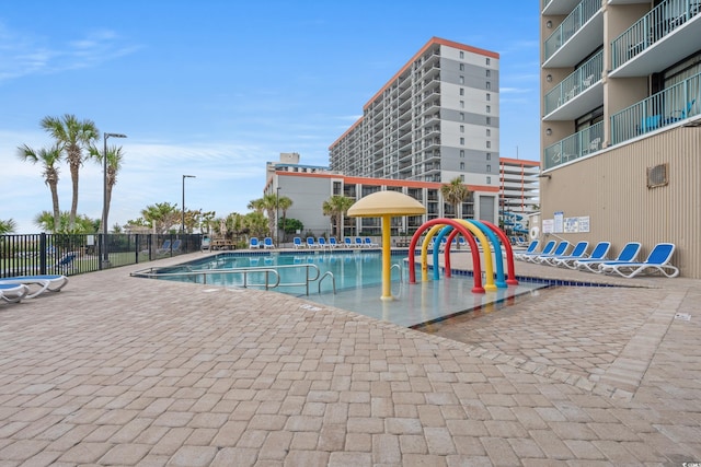 view of pool featuring a playground