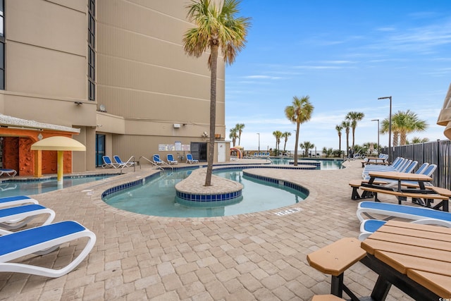 view of swimming pool featuring a patio area