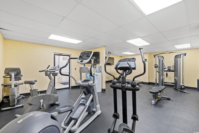 exercise room featuring a paneled ceiling