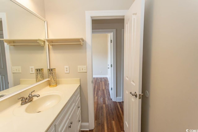 bathroom with wood-type flooring and vanity