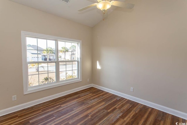 spare room featuring ceiling fan, dark hardwood / wood-style flooring, and lofted ceiling