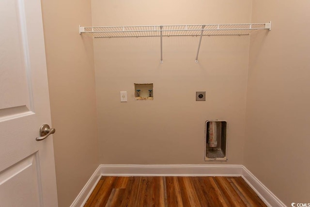 washroom featuring electric dryer hookup, hookup for a washing machine, and dark hardwood / wood-style floors