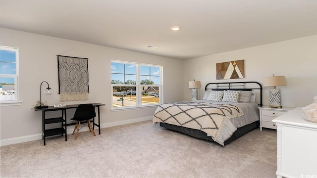 bedroom featuring light colored carpet