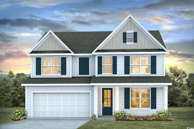 view of front facade featuring a lawn and a garage