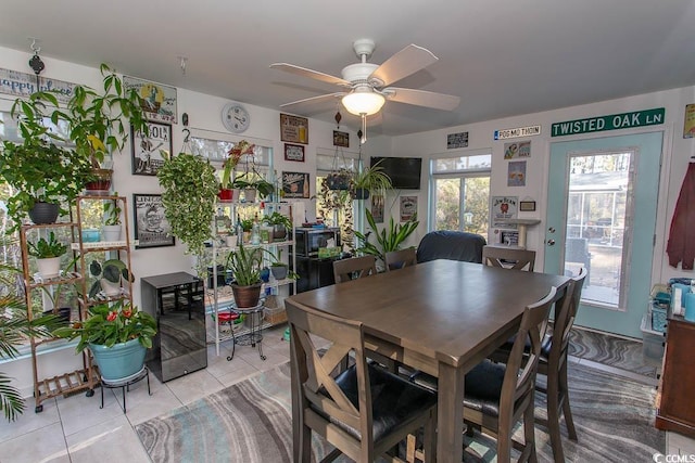 dining room with ceiling fan, light tile patterned flooring, and wine cooler