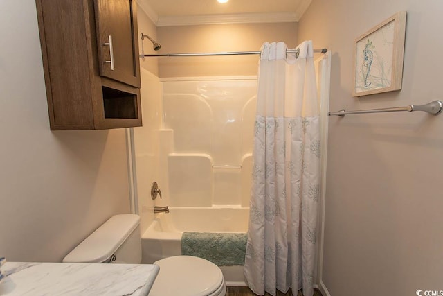 bathroom with toilet, shower / tub combo, and crown molding