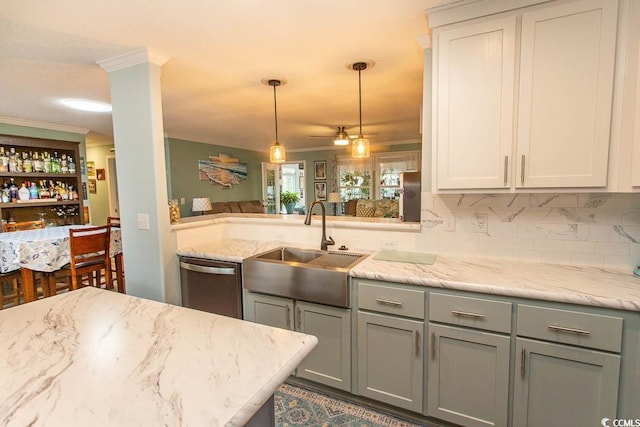 kitchen with dishwasher, pendant lighting, gray cabinetry, ornamental molding, and sink