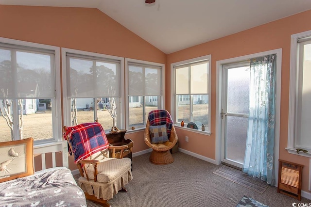 sunroom featuring vaulted ceiling