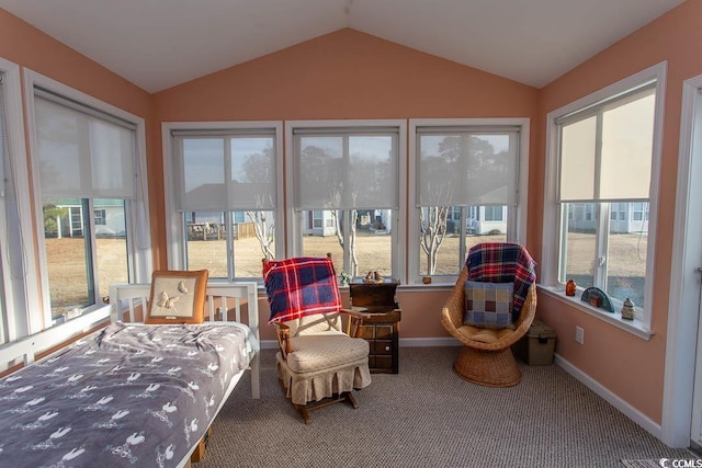 sunroom featuring vaulted ceiling