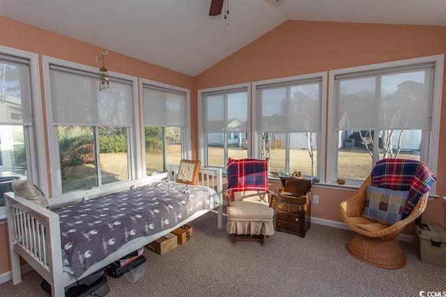 sunroom featuring ceiling fan and vaulted ceiling