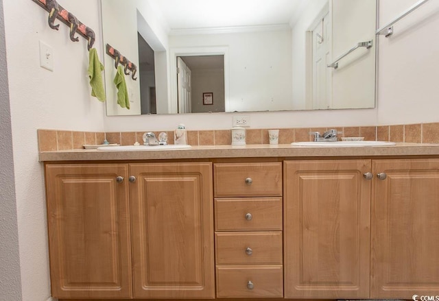 bathroom with crown molding and vanity