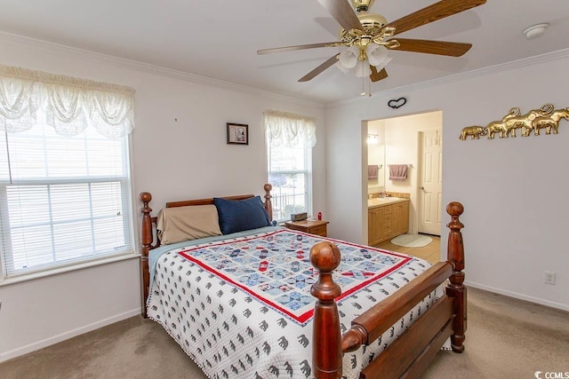 carpeted bedroom with ensuite bath, ceiling fan, and crown molding