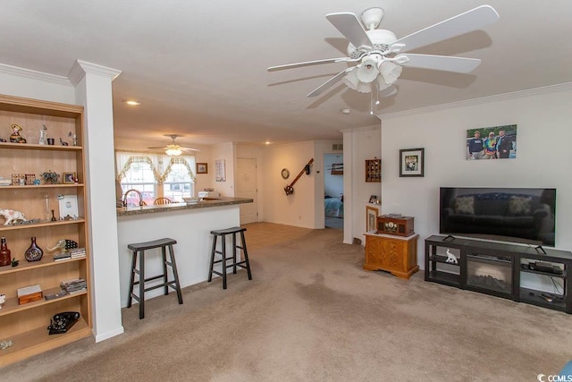 living room with light colored carpet and crown molding