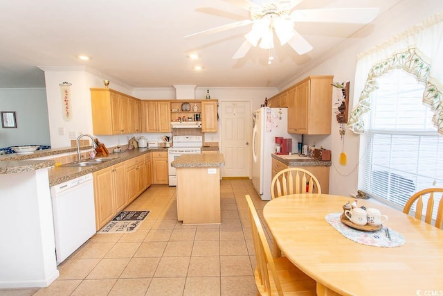 kitchen with white appliances, light tile patterned floors, a kitchen island, light brown cabinets, and sink