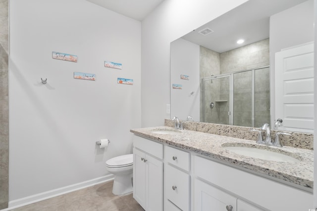 bathroom with a shower with shower door, tile patterned floors, toilet, and vanity