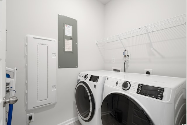 washroom featuring separate washer and dryer and electric panel