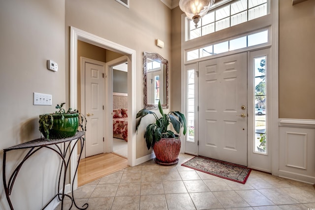 tiled foyer entrance featuring a wealth of natural light