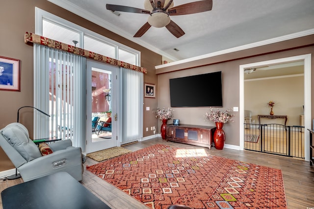 living room featuring ornamental molding and wood-type flooring