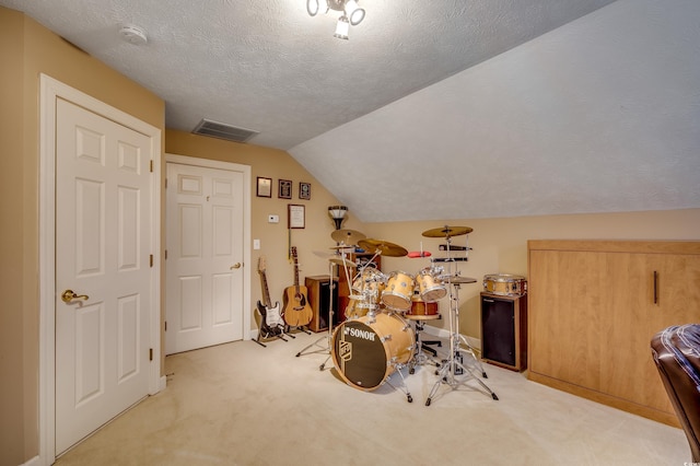 bonus room featuring light colored carpet, vaulted ceiling, and a textured ceiling