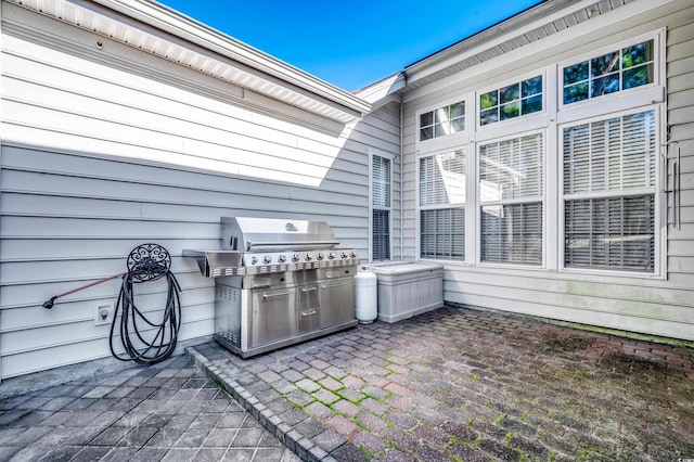 view of patio featuring a grill