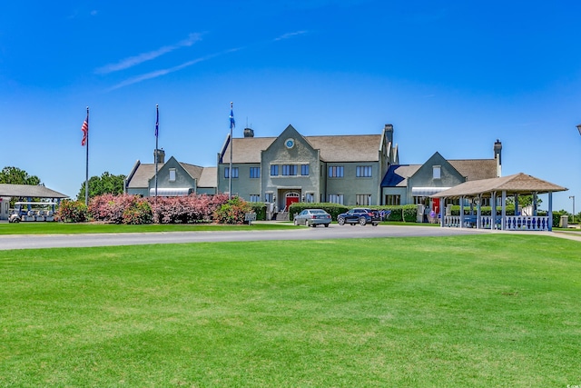 view of property's community with a yard